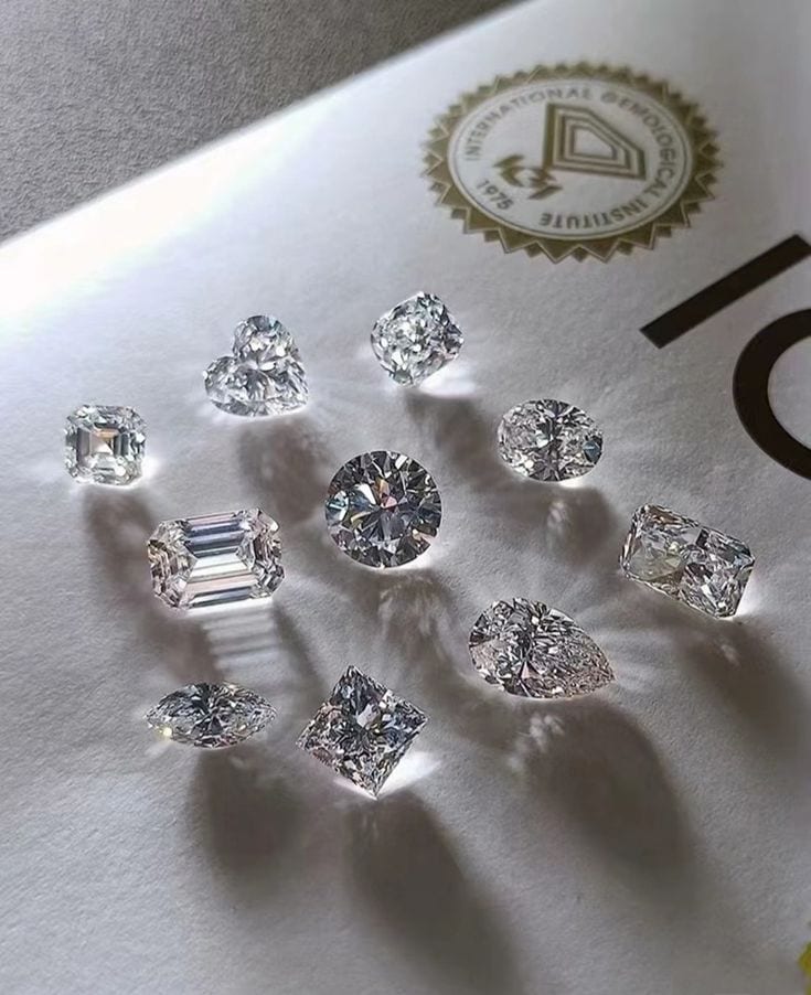 Collection of lab-grown diamond shapes arranged in a studio